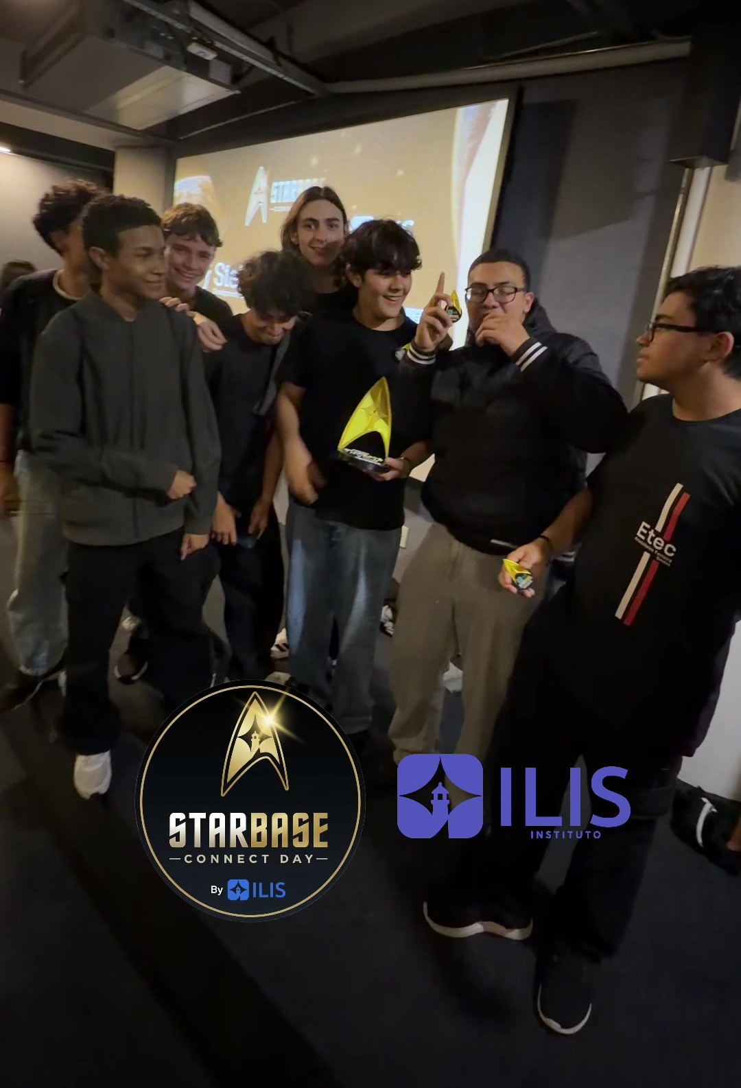 StarBase Connect Day winning team members hold a trophy.